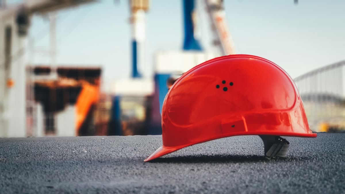 Industrial worker wearing a safety helmet and protective equipment